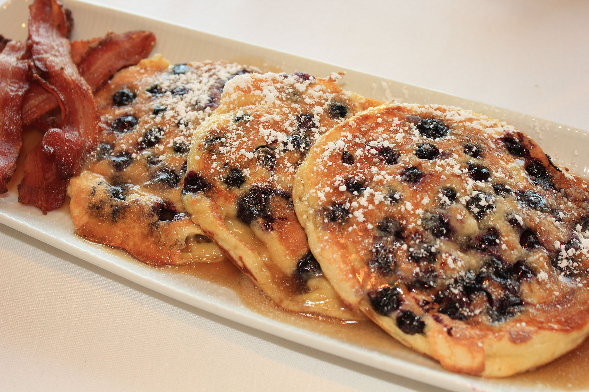 lotsa blueberry pancakes with italian bacon